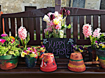 Photograph of flowers grown by the children of Nettlestone School Nursery displayed in St Peter's Garden Easter 2020